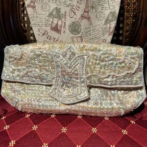 La Regale vintage cream colored clutch
